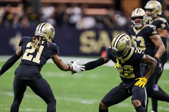 New Orleans Saints cornerback Bradley Roby (21) celebrates with defensive back Chauncey Gardner-Johnson (22). Mandatory Credit: Stephen Lew-USA TODAY Sports